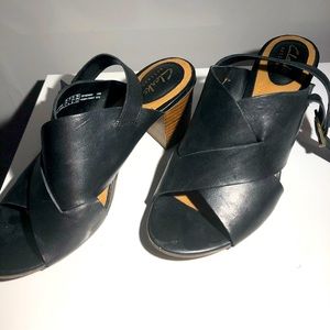 Black leather heels with strap for comfort.